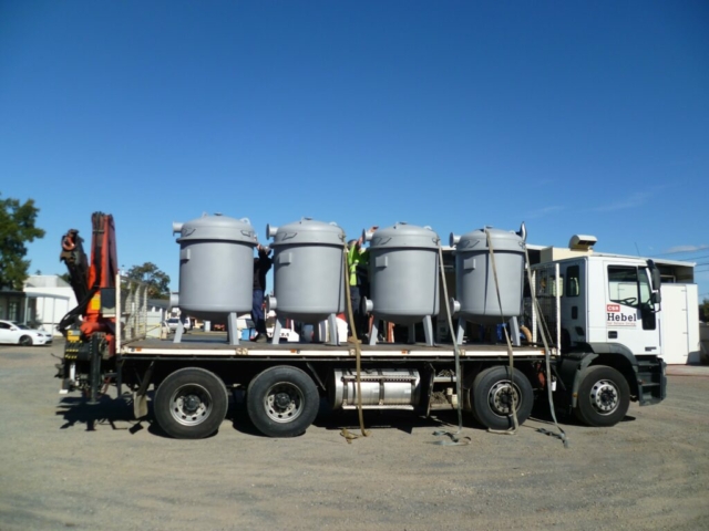 Water tanks being transported by a truck