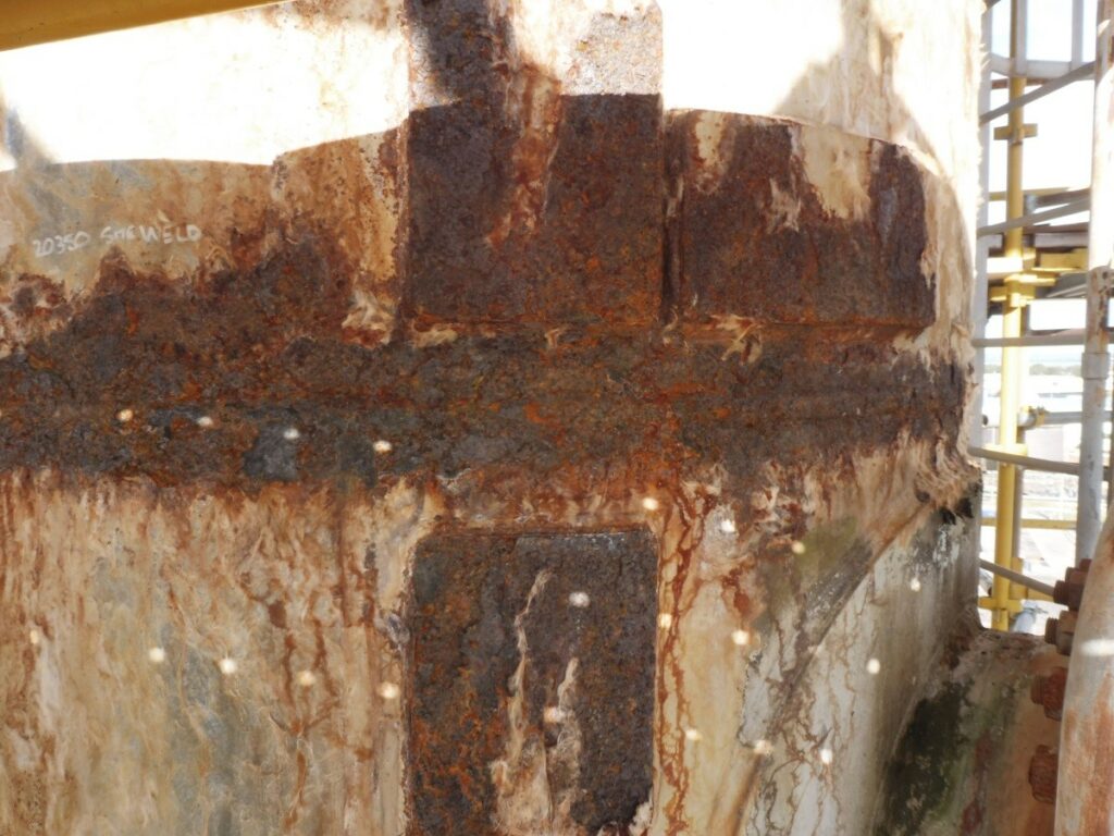 Unlagged corroded zone near top